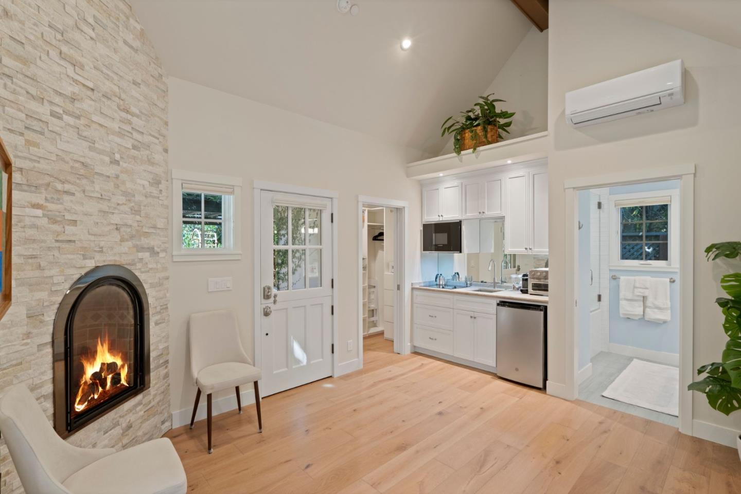 70 Joyce Road Hillsborough, CA 94010 - Photo 80 of 100 a large kitchen with a fireplace and cabinets