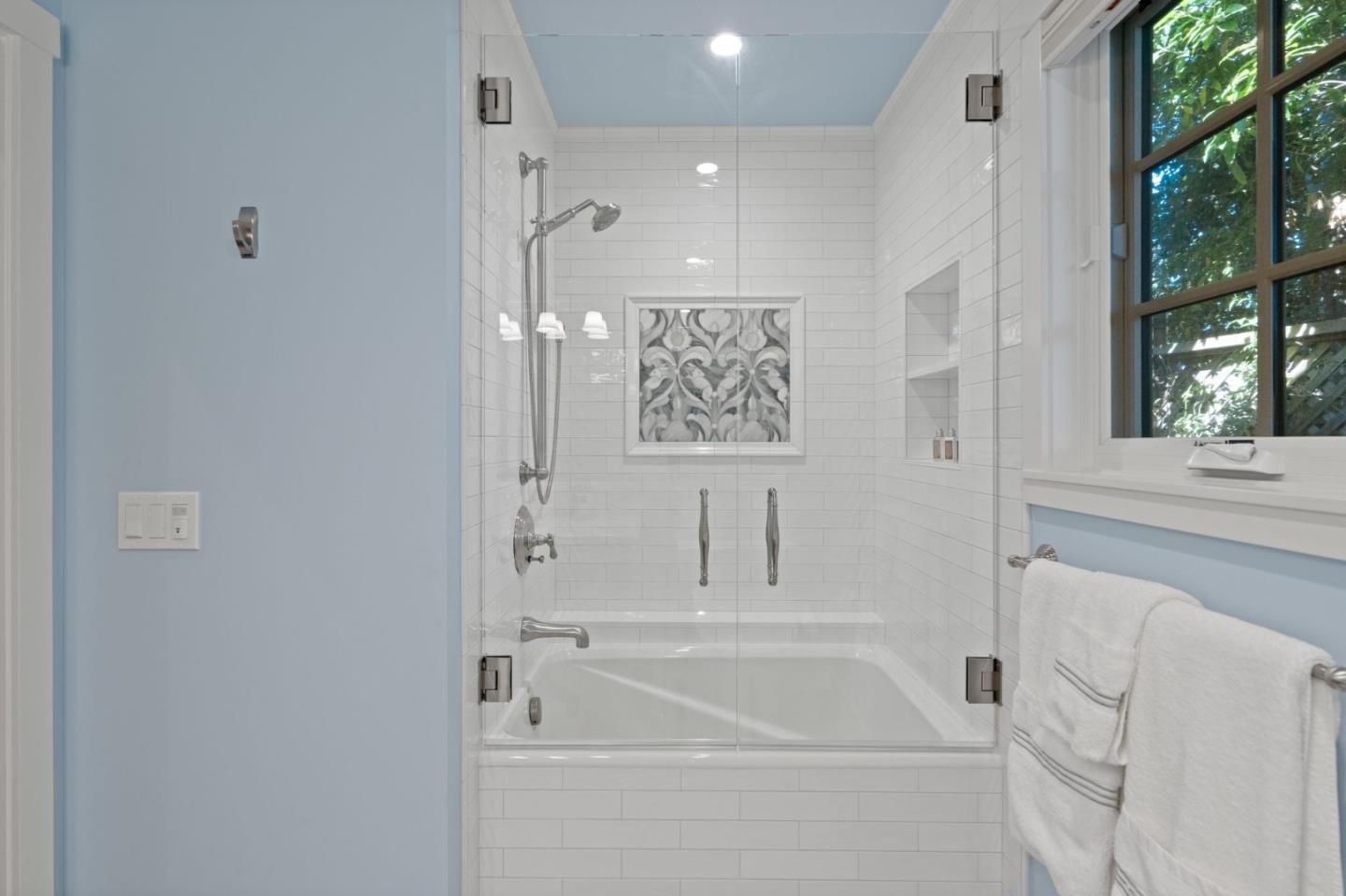 70 Joyce Road Hillsborough, CA 94010 - Photo 82 of 100 a bathroom with a bathtub and a shower