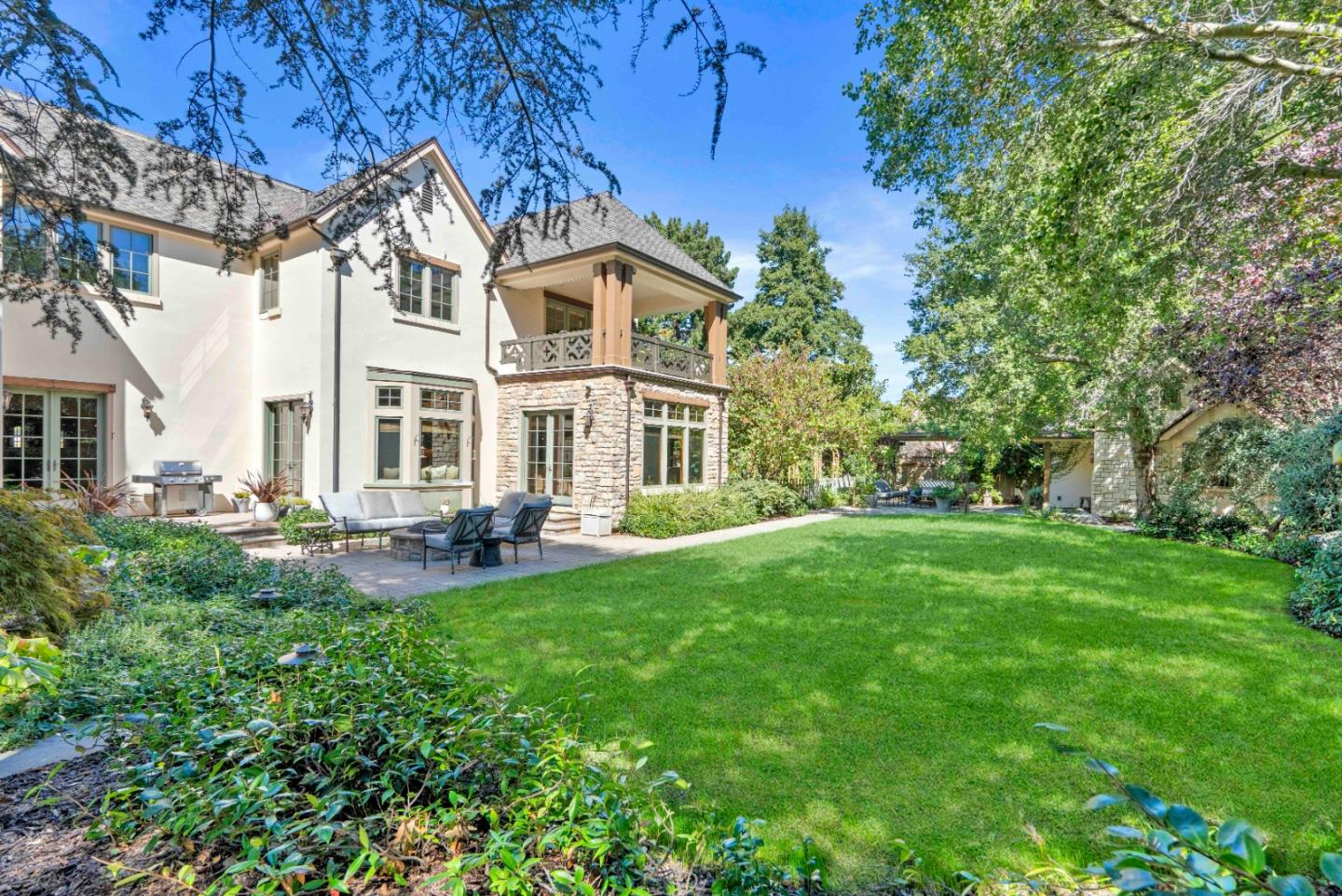 70 Joyce Road Hillsborough, CA 94010 - Photo 87 of 100 a front view of a house with a yard table and chairs
