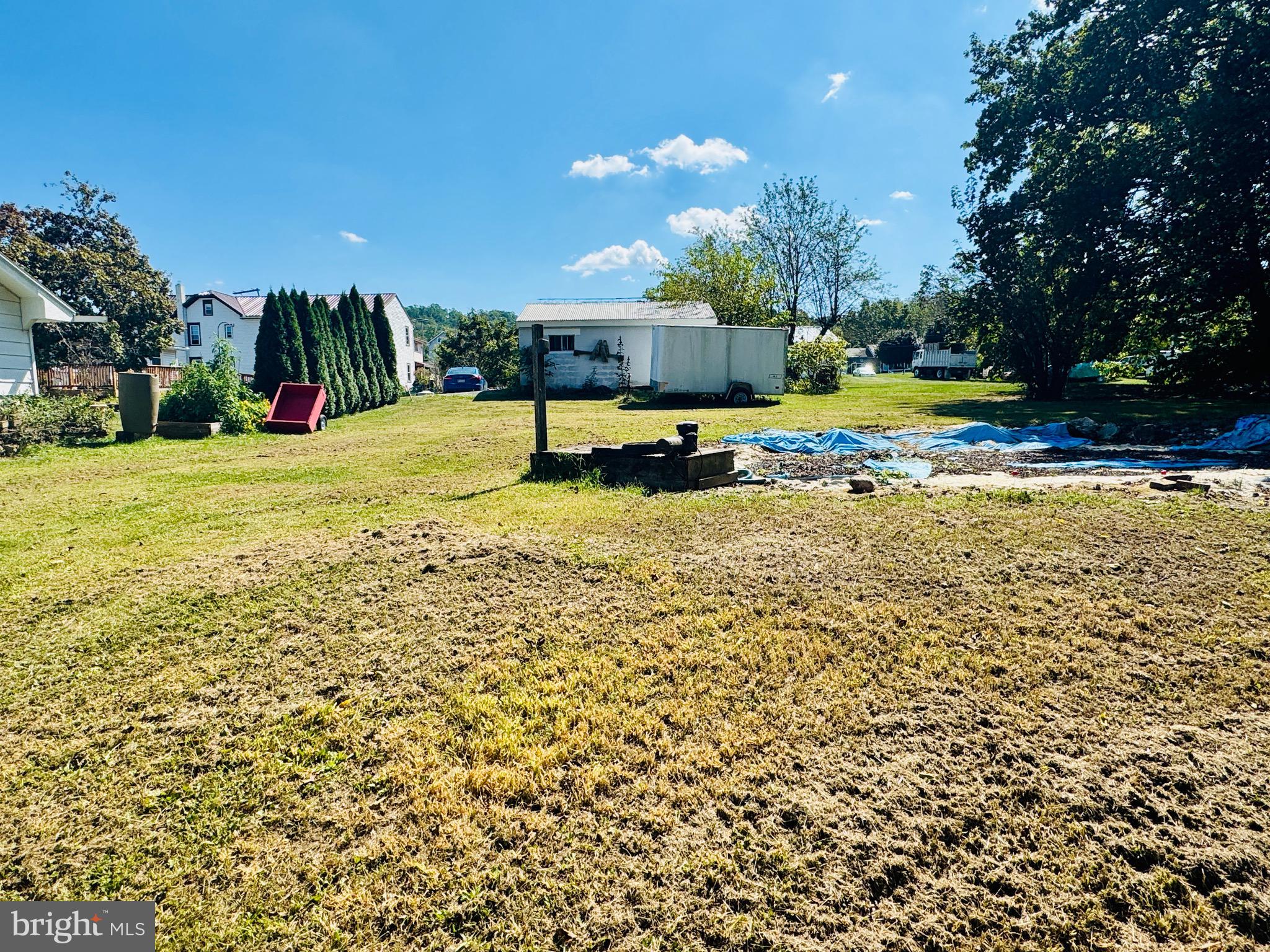895 Pleasant Hill Road Fleetwood, PA 19522 - Photo 17 of 36 a view of a swimming pool with an outdoor space and seating area
