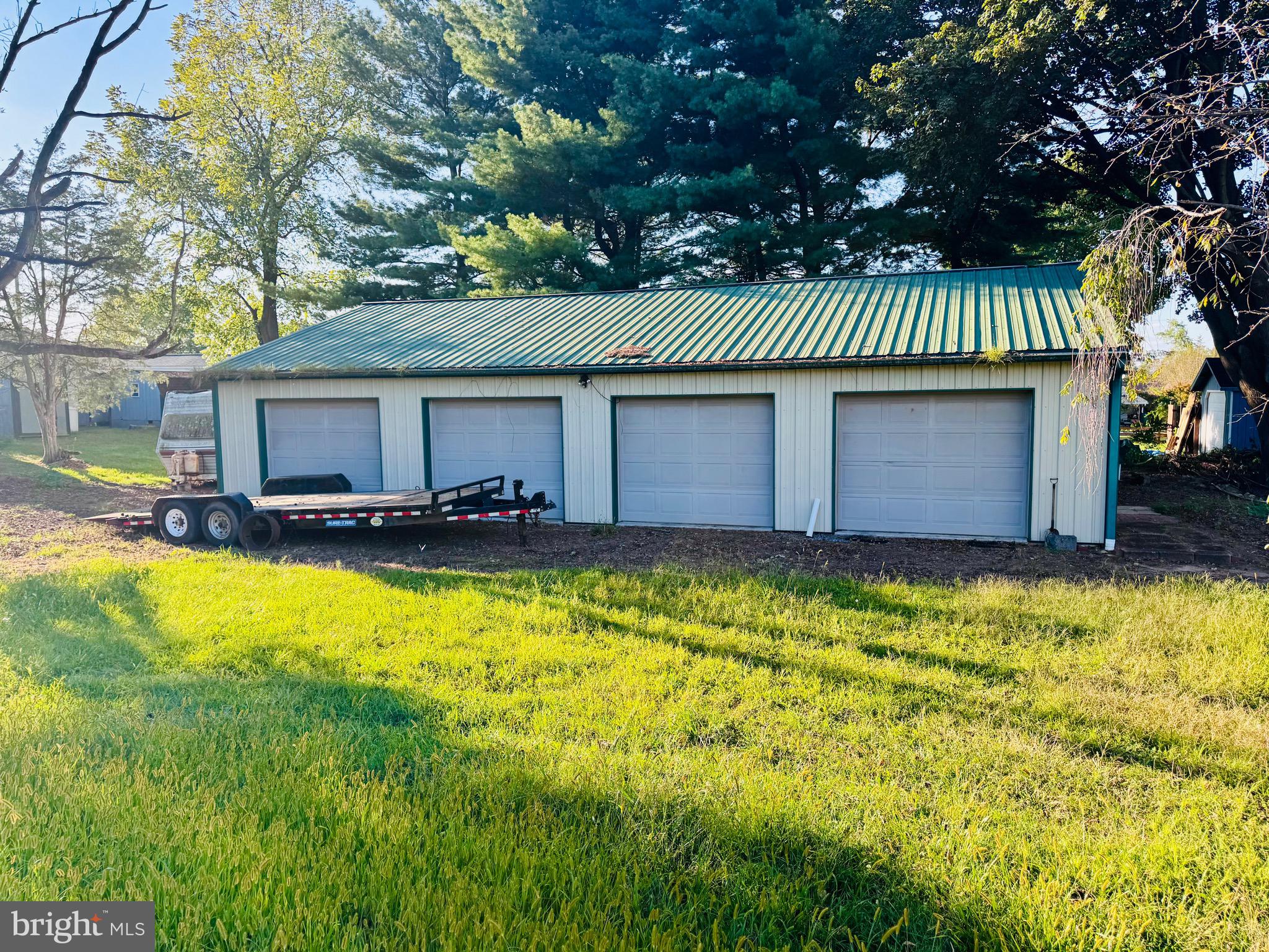 895 Pleasant Hill Road Fleetwood, PA 19522 - Photo 4 of 36 a front view of a house with a yard