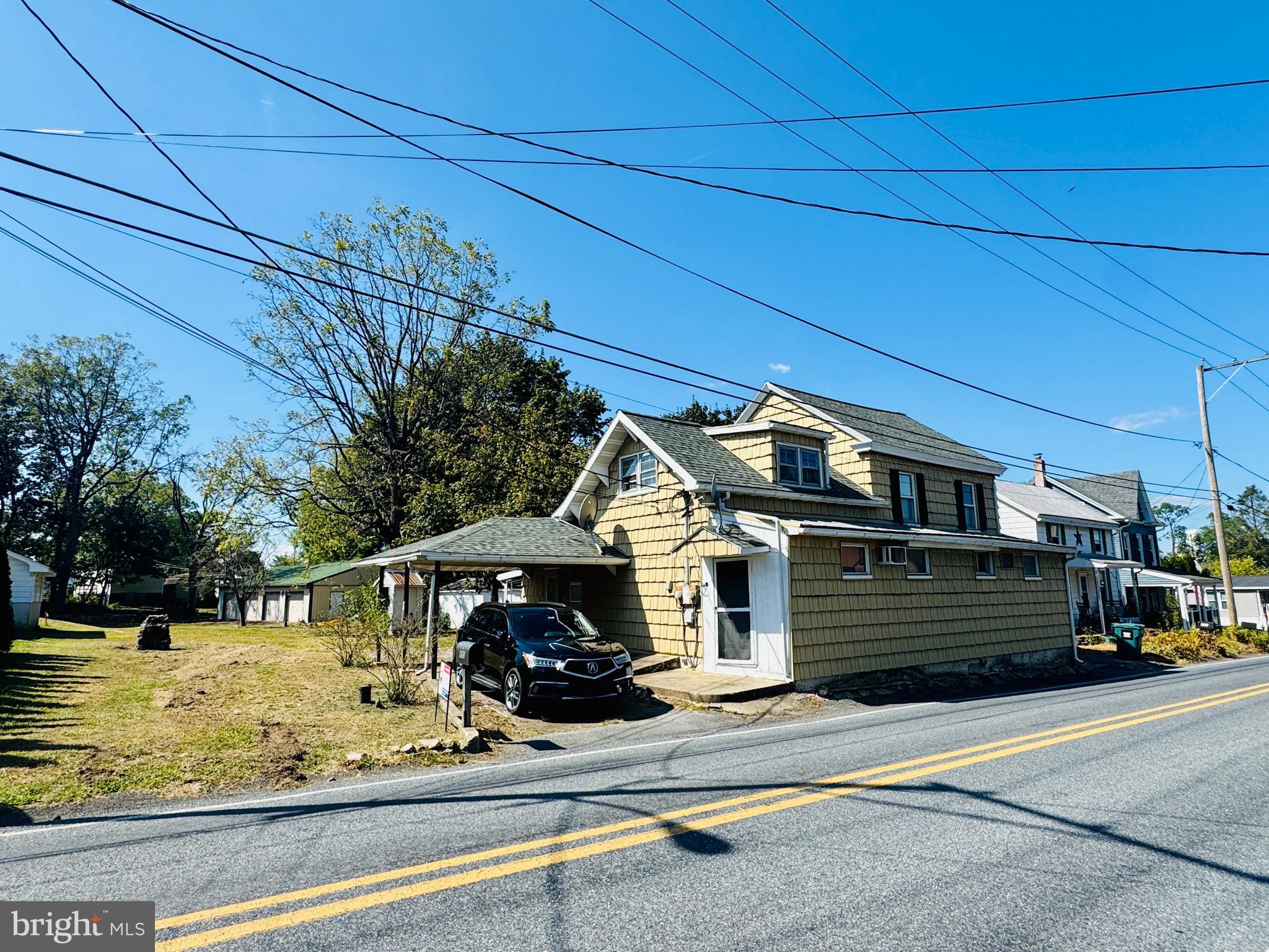 895 Pleasant Hill Road Fleetwood, PA 19522 - Photo 10 of 36 a front view of a house with a yard