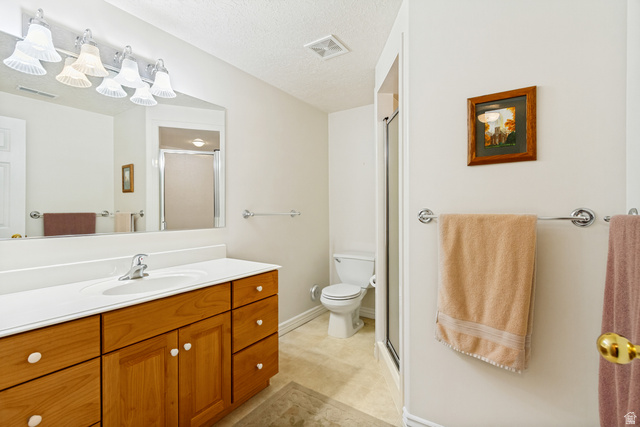 298 North Canyon Road Bountiful, UT 84010 - Photo 50 of 57 Bathroom featuring a wood-finish vanity with an integrated sink and a white countertop