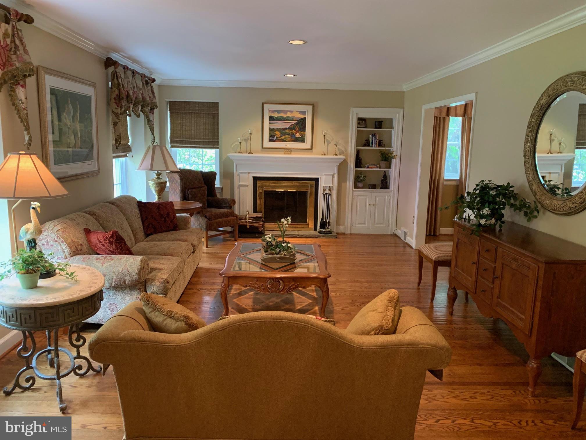 624 Paddock Road Havertown, PA 19083 - Photo 8 of 48 Gas fireplace with mantel and built-in cabinetry