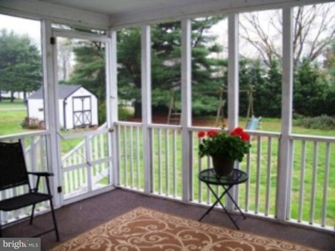 2035 Papas Lane Lusby, MD 20657 - Photo 11 of 12 a view of a porch with furniture and garden