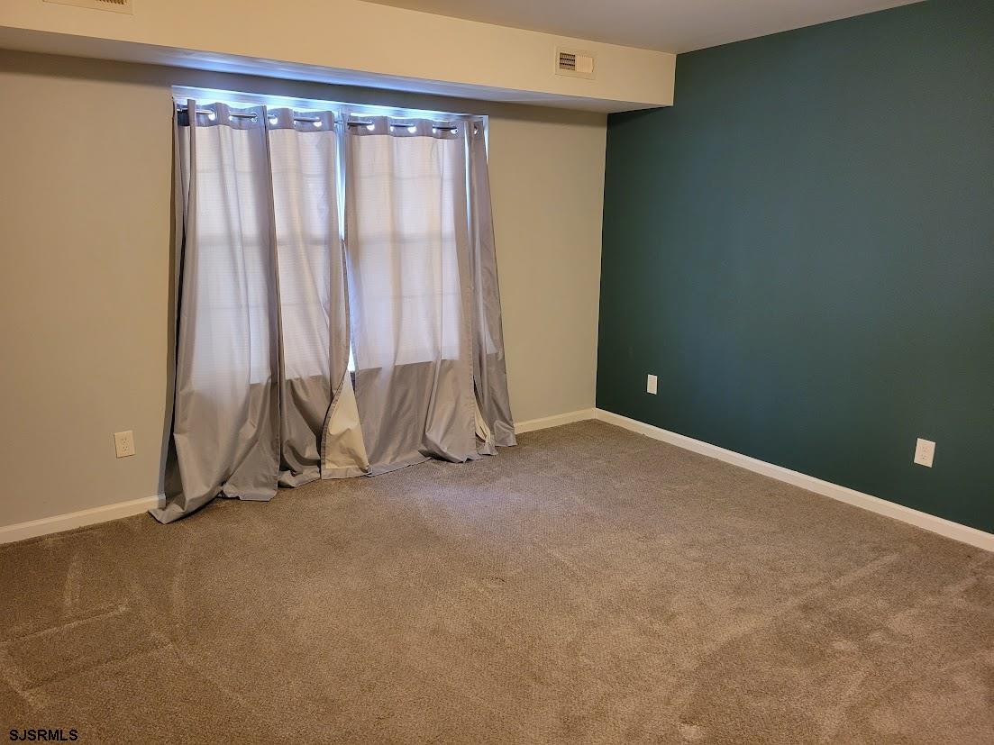 99 Club Place, Unit 99 Galloway Township, NJ 08205 - Photo 17 of 24 a view of an empty room with a birdcage