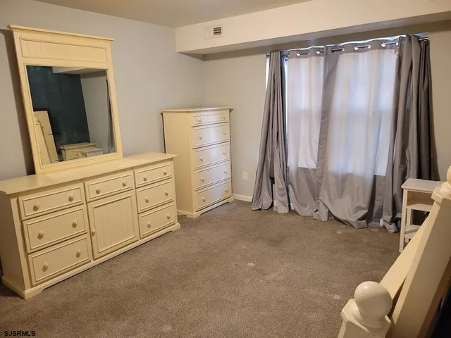 a bathroom with a shower toilet and sink