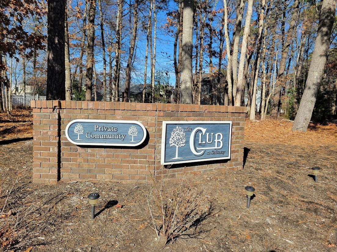 99 Club Place, Unit 99 Galloway Township, NJ 08205 - Photo 2 of 24 a view of outdoor space with sign board