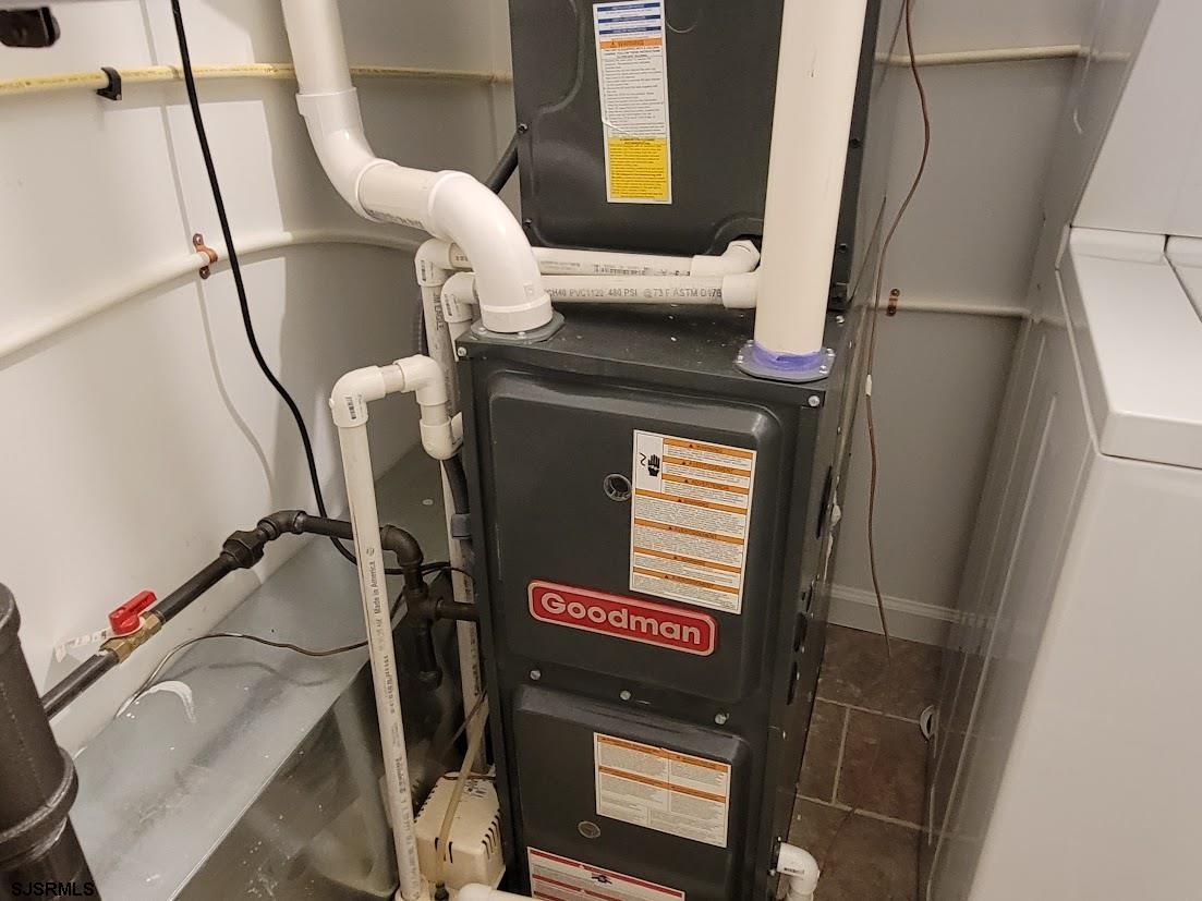 99 Club Place, Unit 99 Galloway Township, NJ 08205 - Photo 22 of 24 a bathroom with a sink and a mirror