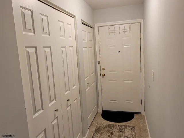 a kitchen with cabinets stainless steel appliances and wooden cabinets