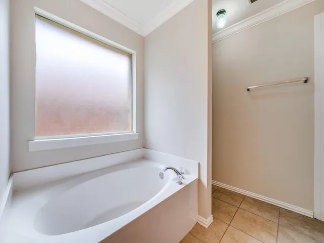 a bathroom with a double vanity sink mirror and shower