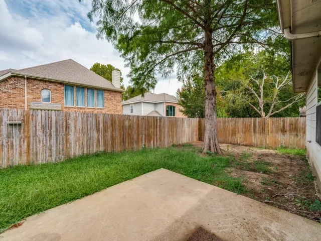 a backyard of a house with lots of green space