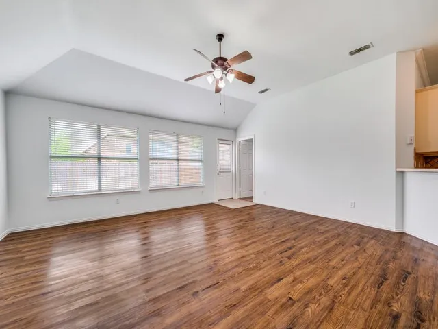 a kitchen with a white cabinets and white appliances