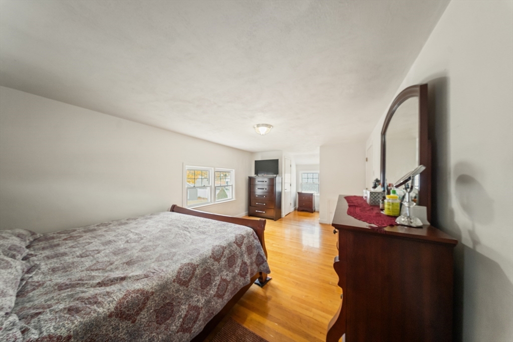 1078 Liberty Street Springfield, MA 01104 - Photo 19 of 42 a bedroom with bed and window