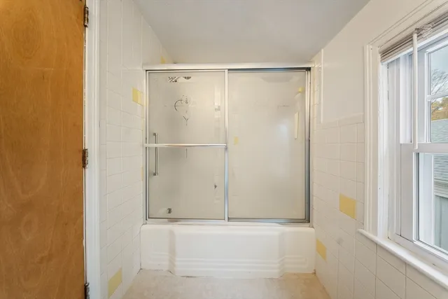 a bathroom with a toilet sink and a mirror