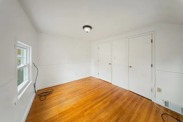 a view of a big room with windows