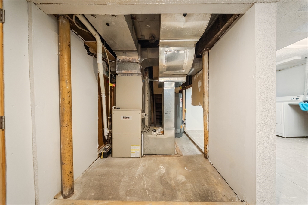 1078 Liberty Street Springfield, MA 01104 - Photo 29 of 42 a view of a hallway with wooden shelves