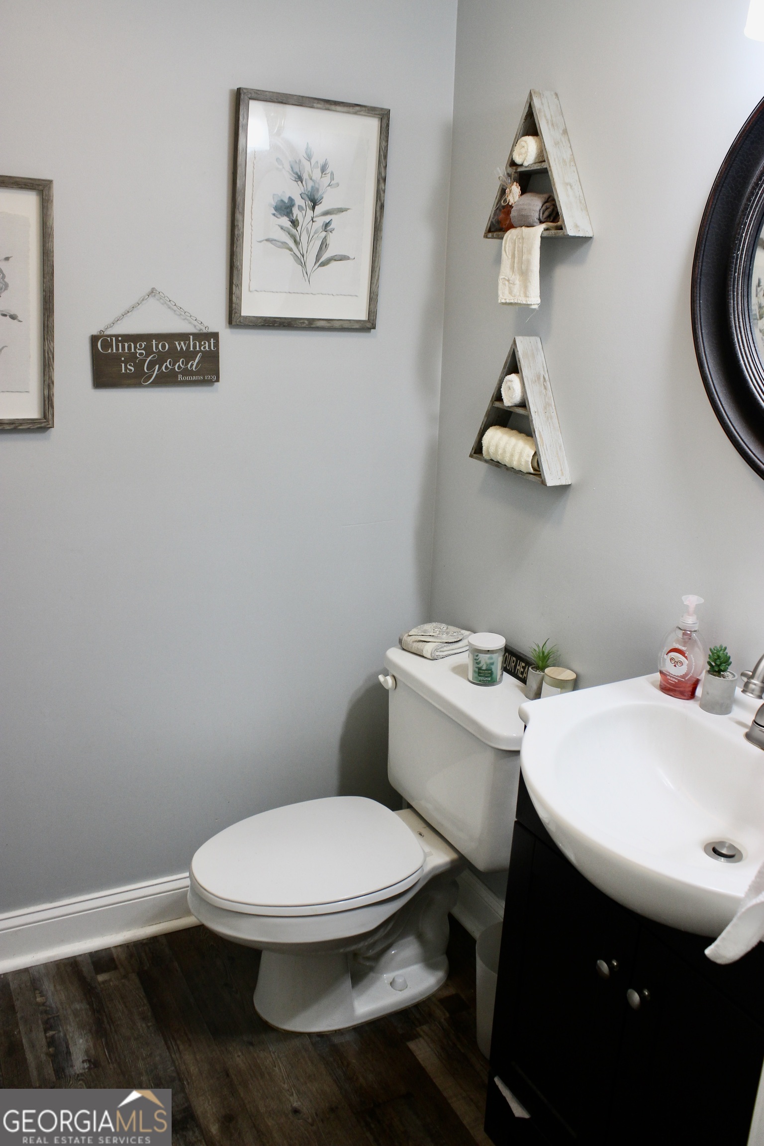 3631 Clay Circle Macon, GA 31216 - Photo 13 of 32 a white toilet sitting next to a bathroom sink