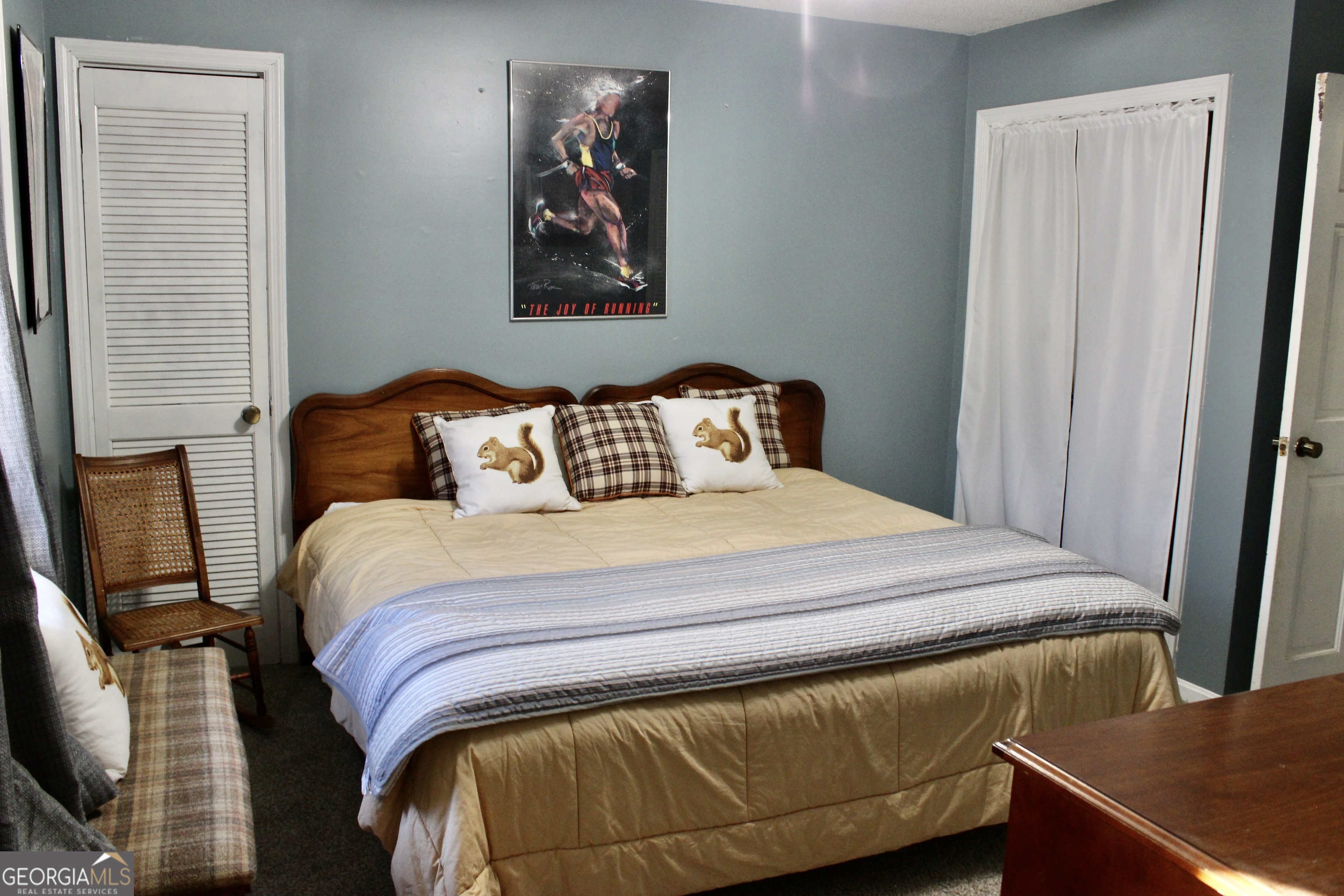 3631 Clay Circle Macon, GA 31216 - Photo 17 of 32 a bedroom with a bed and wooden floor