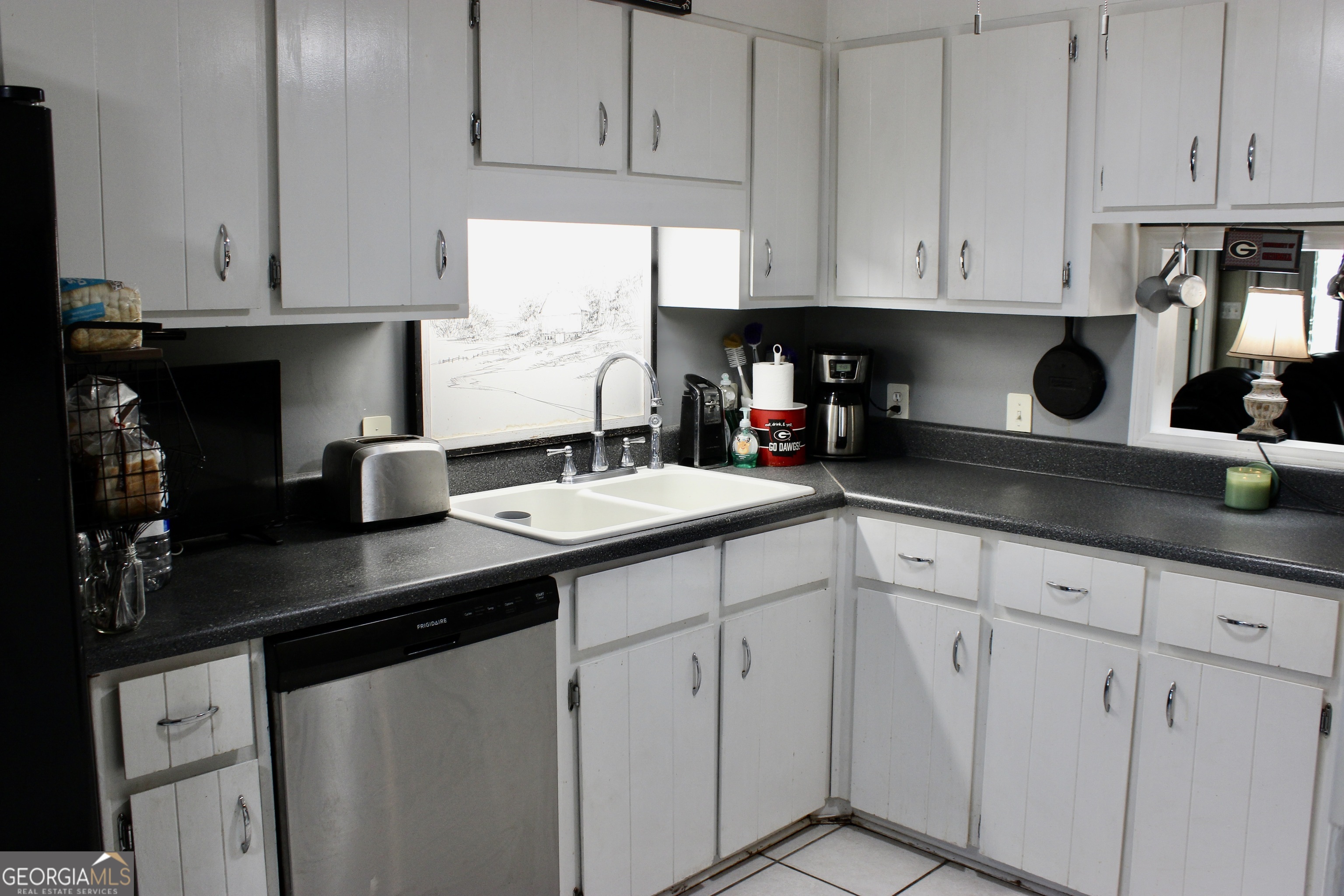 3631 Clay Circle Macon, GA 31216 - Photo 8 of 32 a kitchen with stainless steel appliances granite countertop white cabinets sink and dishwasher
