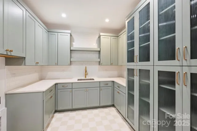 a kitchen with a sink and cabinets