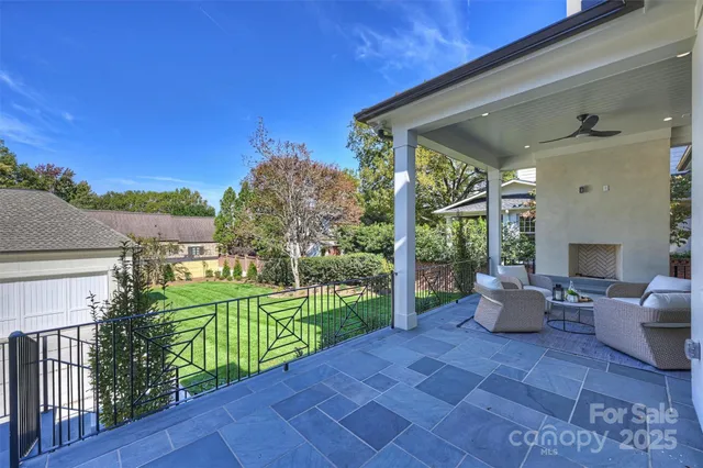 a view of a porch with furniture and garden
