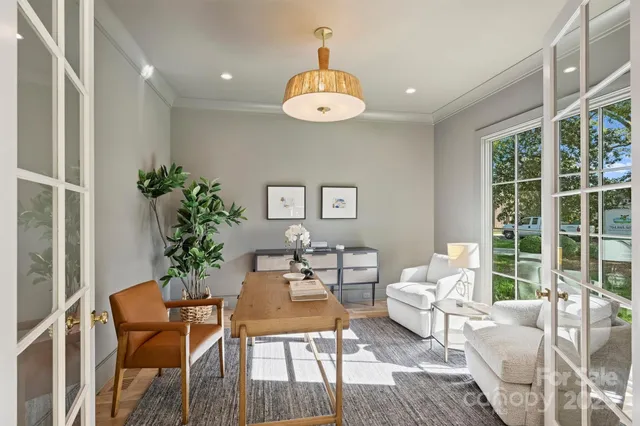 a dining room with furniture window and outside view