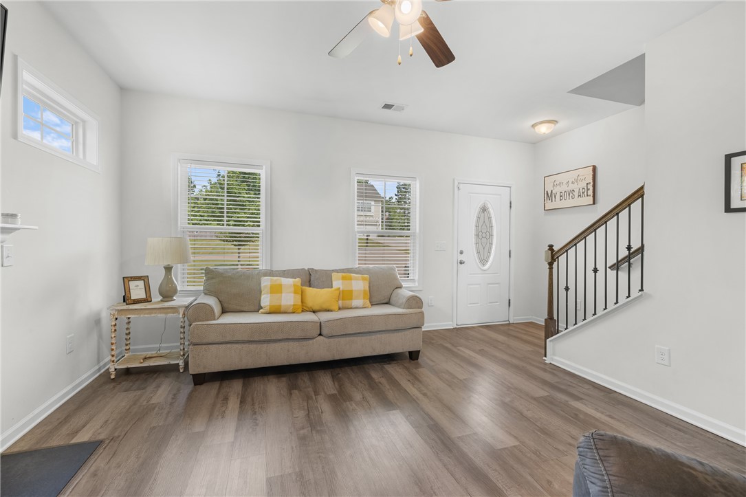 768 Rocky Ridge Circle Seneca, SC 29678 - Photo 9 of 30 A welcoming entry living area features resilient plank flooring and a classic staircase.