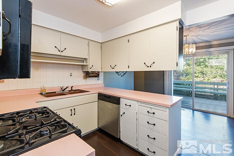 1430 Alturas Avenue Reno, NV 89503 - Photo 4 of 15 a kitchen with a stove a sink and a refrigerator