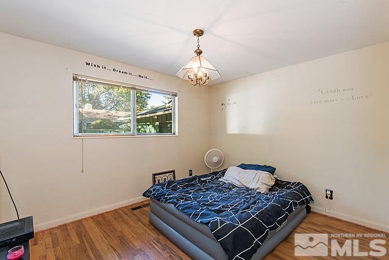 1430 Alturas Avenue Reno, NV 89503 - Photo 9 of 15 a bedroom with a bed and a window