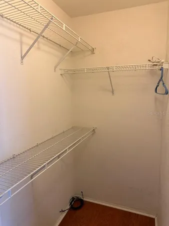 a view of a room with racks on the wall