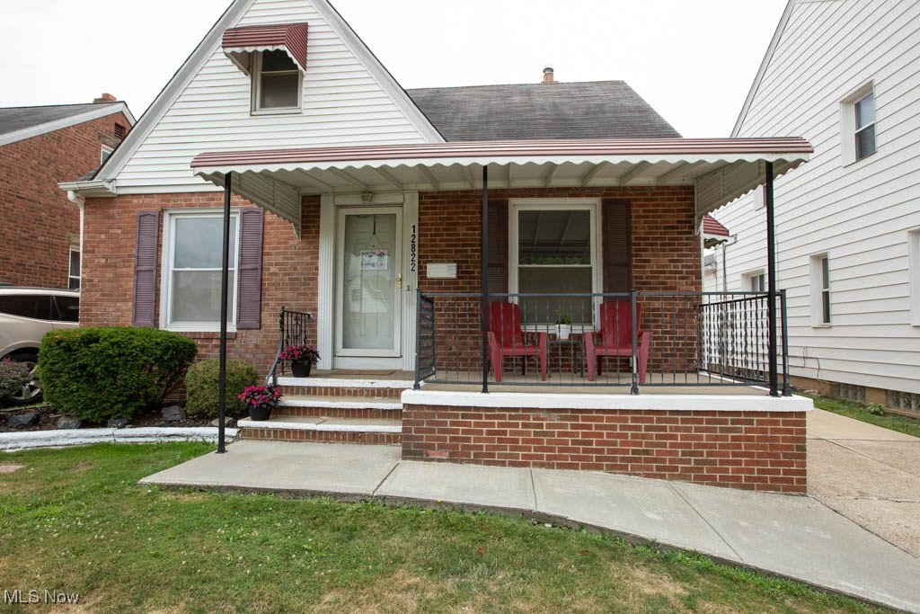 12822 Grannis Road Cleveland, OH 44125 - Photo 30 of 44 View of front facade featuring covered porch