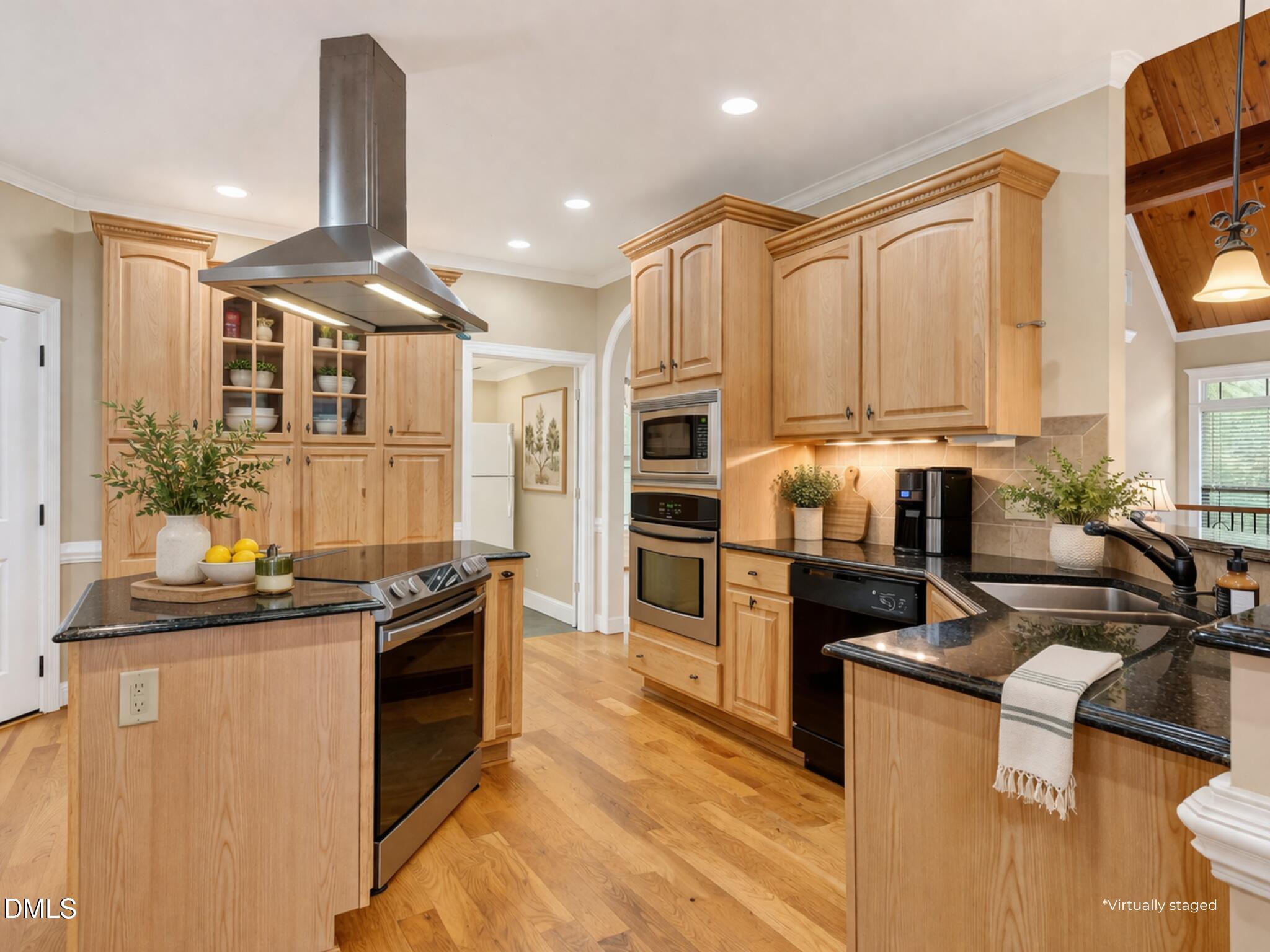 6570 Highway 231 Middlesex, NC 27557 - Photo 19 of 71 a kitchen with stainless steel appliances a sink a stove and a refrigerator