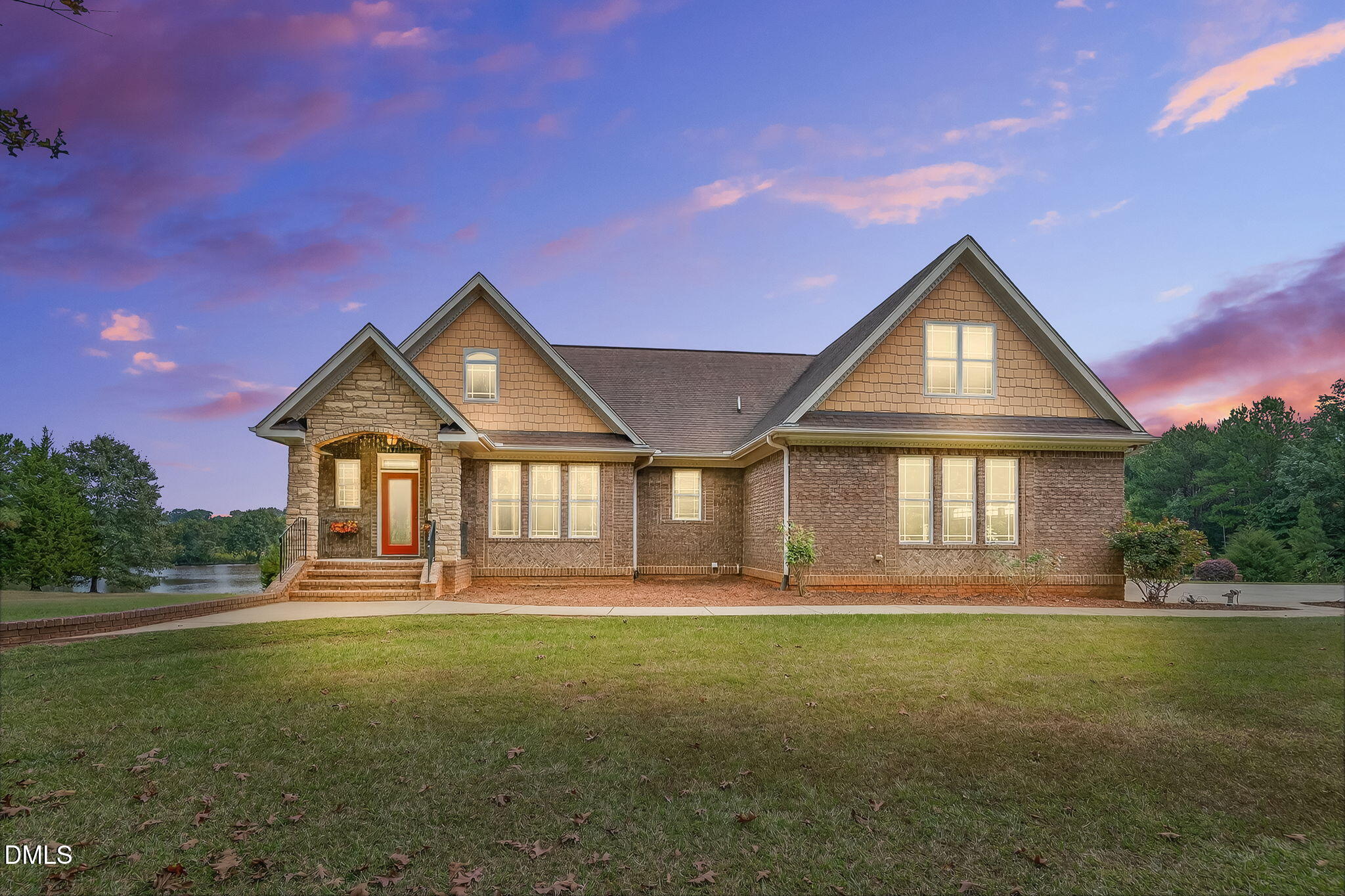 6570 Highway 231 Middlesex, NC 27557 - Photo 63 of 71 a front view of a house with a yard and garage