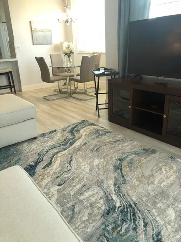 a living room with furniture and a table