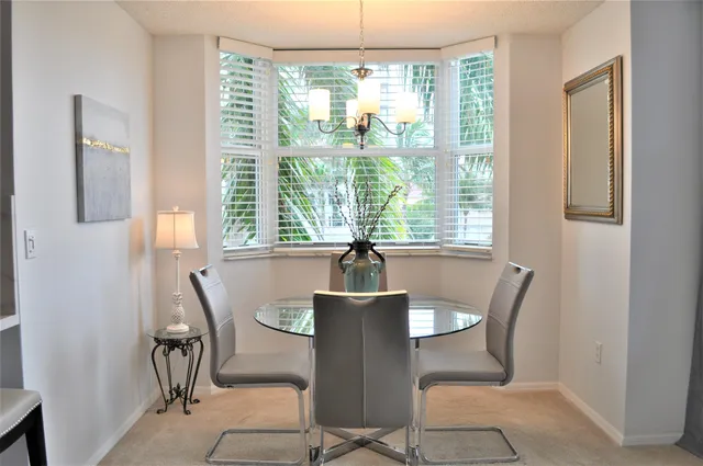 a bathroom with a sink toilet vanity and shower