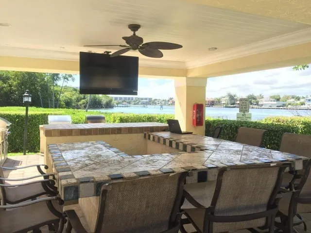 a view of an outside dining space with furniture