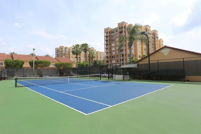a view of a roof deck with wooden floor and fence