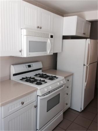 224 Red Gable Road East Brookfield, MA 01515 - Photo 9 of 21 a stove top oven sitting inside of a kitchen