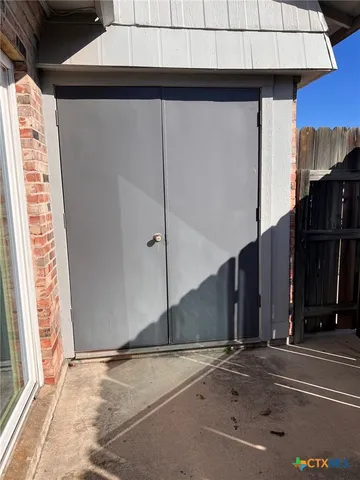 a view of a door and a window