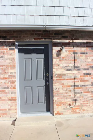 a kitchen with a stove and cabinets