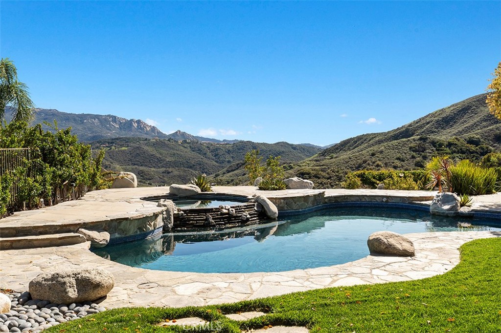 24920 Paseo Del Rancho Calabasas, CA 91302 - Photo 12 of 61 a view of a lake with a mountain in the background