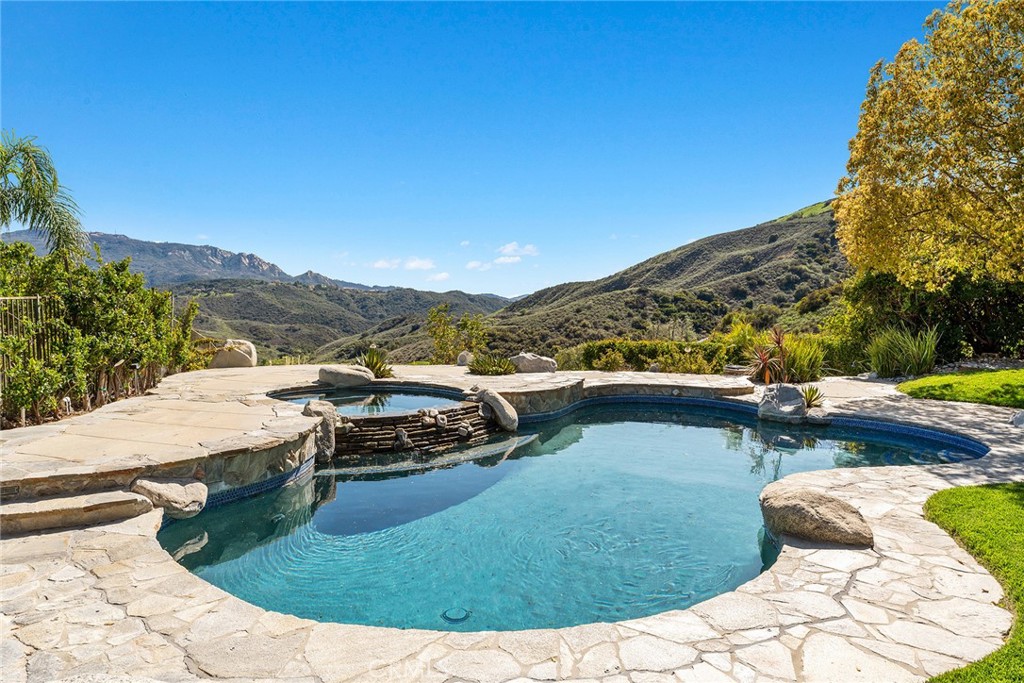 24920 Paseo Del Rancho Calabasas, CA 91302 - Photo 13 of 61 a view of a swimming pool with a yard