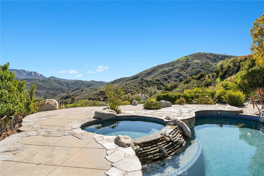 24920 Paseo Del Rancho Calabasas, CA 91302 - Photo 14 of 61 a terrace with outdoor seating and city view