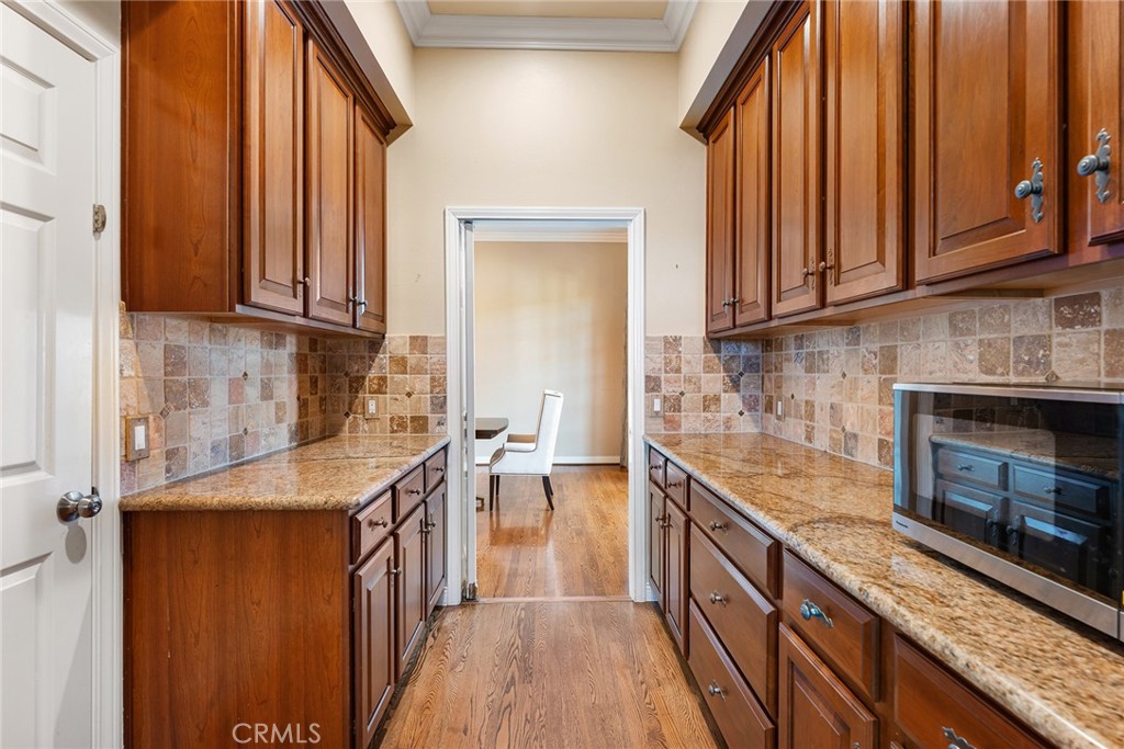 24920 Paseo Del Rancho Calabasas, CA 91302 - Photo 24 of 61 a kitchen with stainless steel appliances granite countertop a sink stove and cabinets