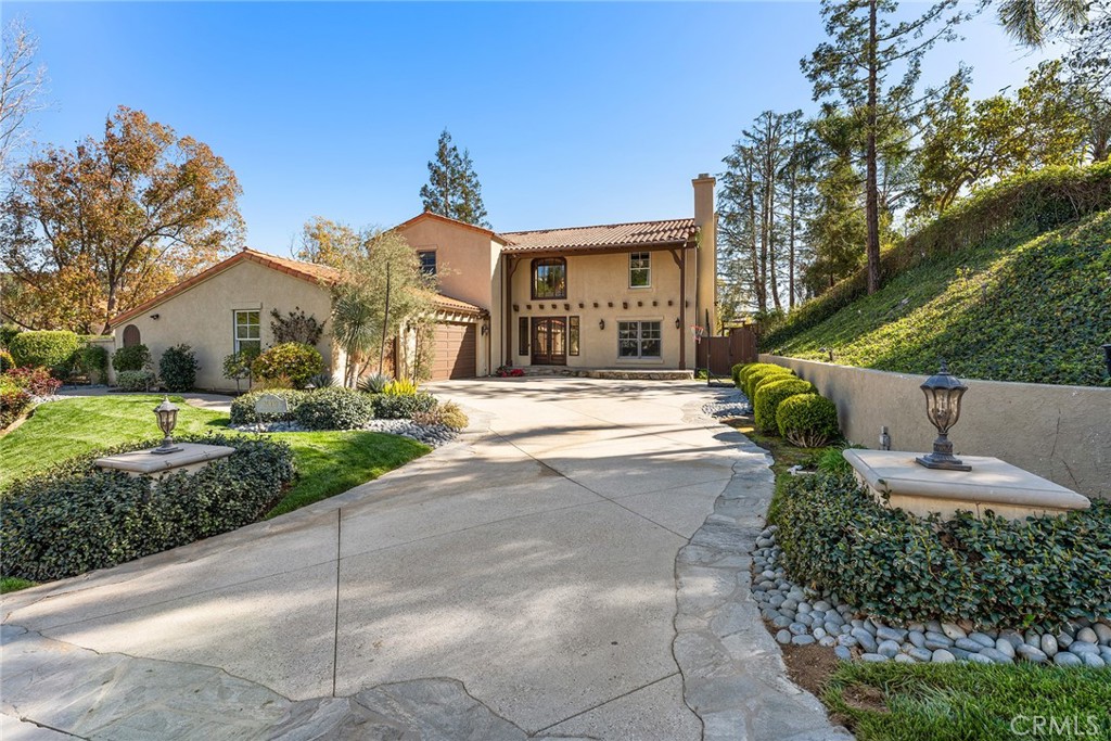 24920 Paseo Del Rancho Calabasas, CA 91302 - Photo 3 of 61 a front view of a house with a yard