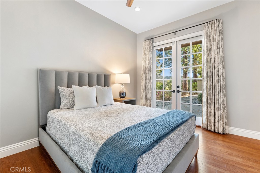 24920 Paseo Del Rancho Calabasas, CA 91302 - Photo 32 of 61 a bedroom with a large bed and a large window