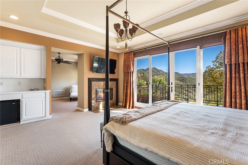 24920 Paseo Del Rancho Calabasas, CA 91302 - Photo 41 of 61 a bedroom with a large bed and a large window