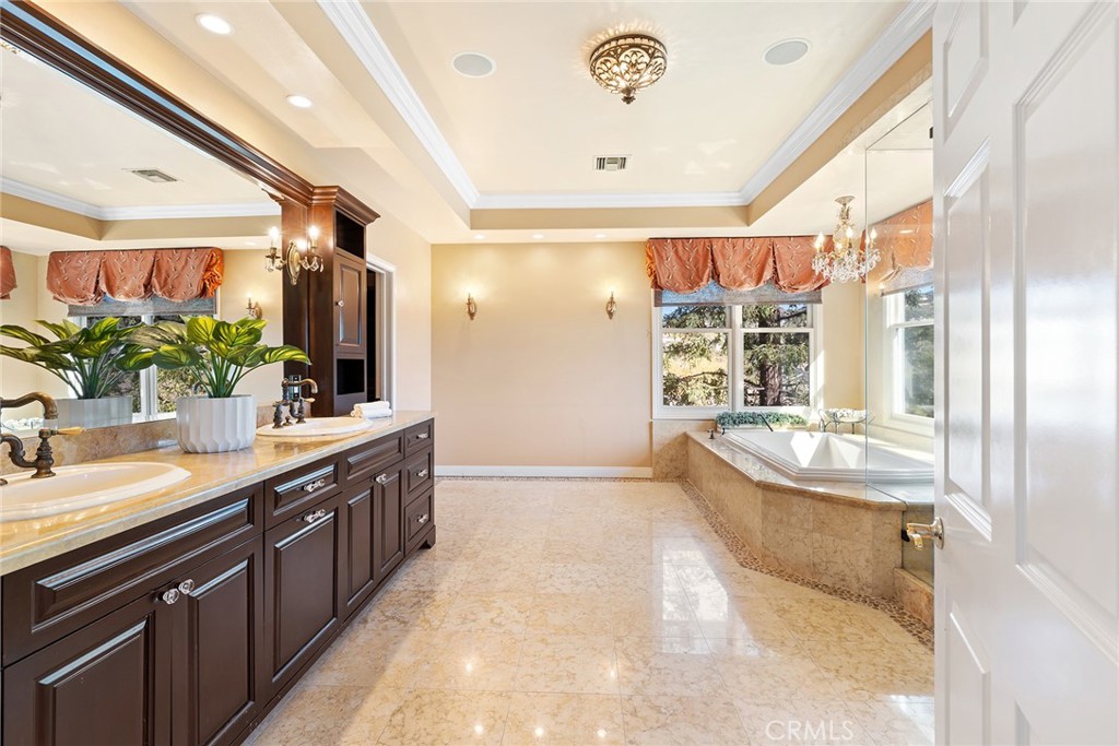 24920 Paseo Del Rancho Calabasas, CA 91302 - Photo 45 of 61 a large bathroom with a large tub and sink