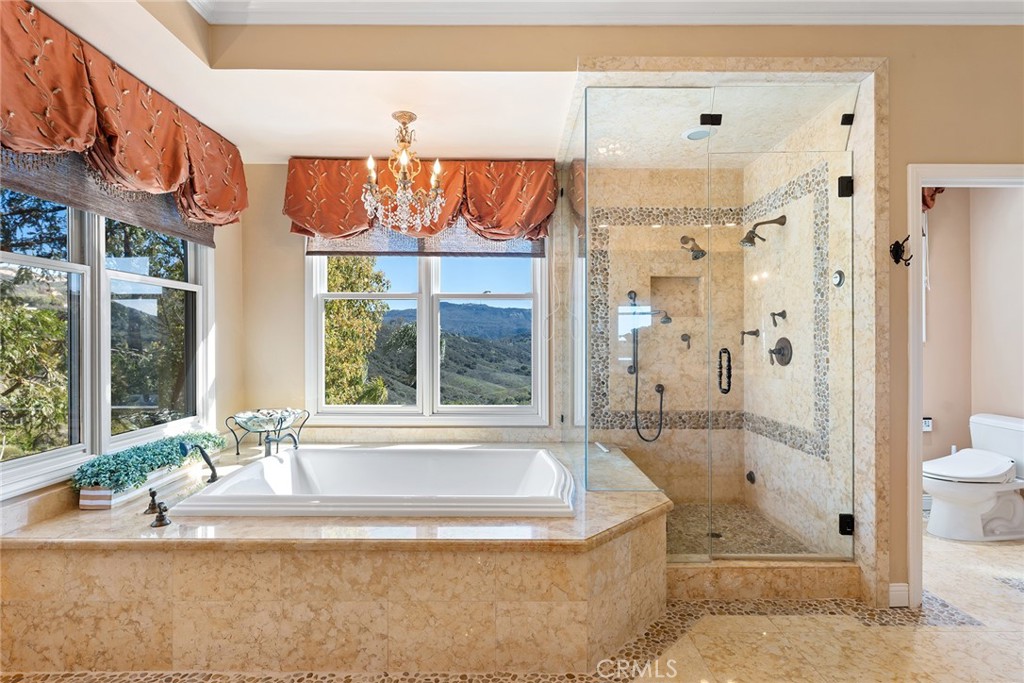 24920 Paseo Del Rancho Calabasas, CA 91302 - Photo 46 of 61 a bathroom with a bathtub and a shower